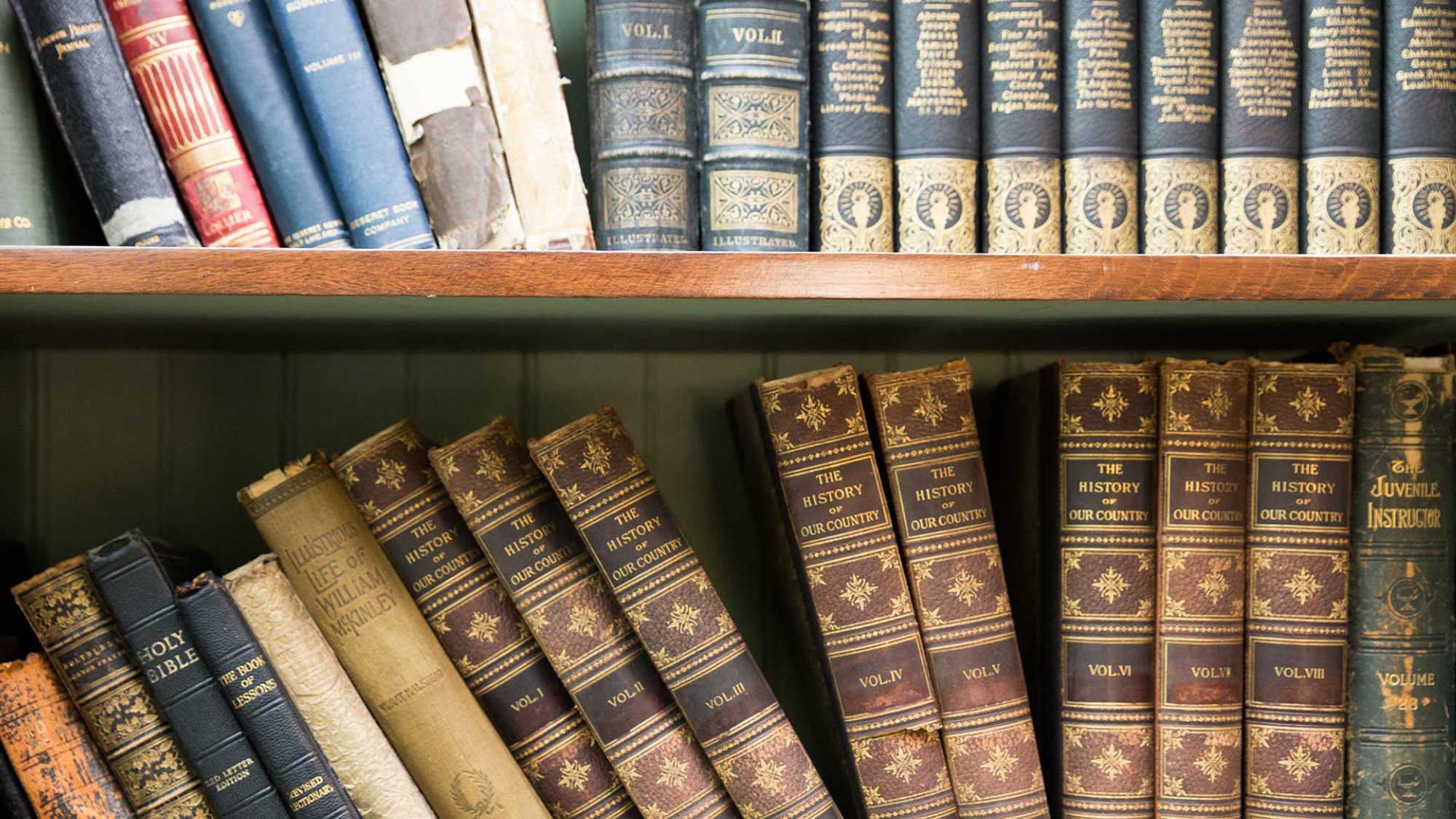 A shelf of antique, collectible books