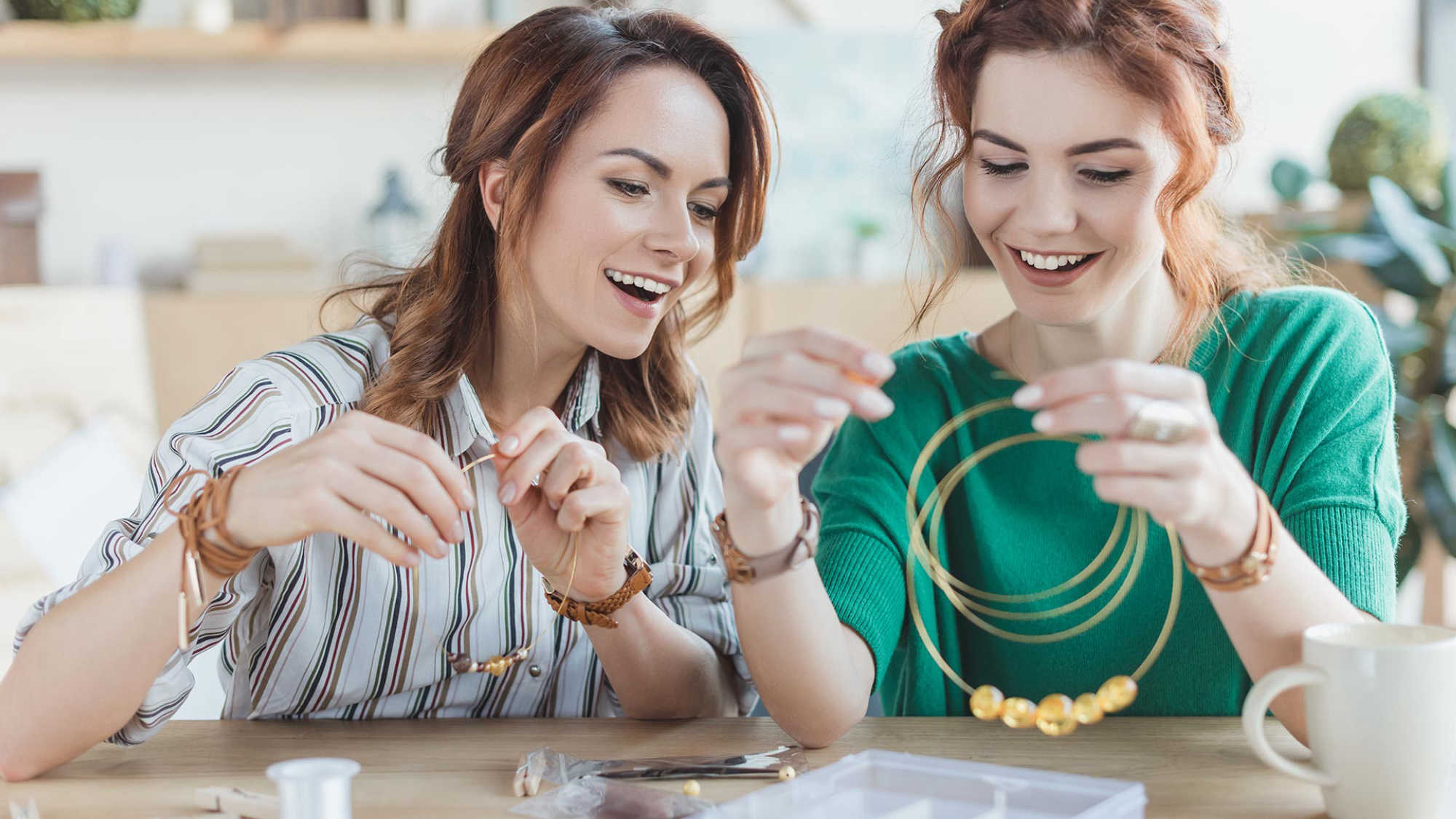 Two women making jewelry