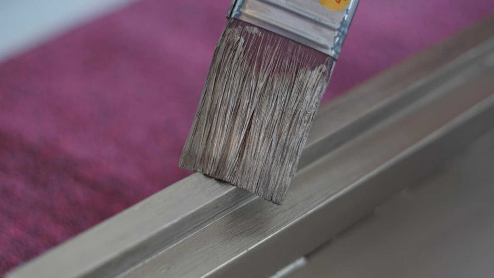 A desk being painted with a brush