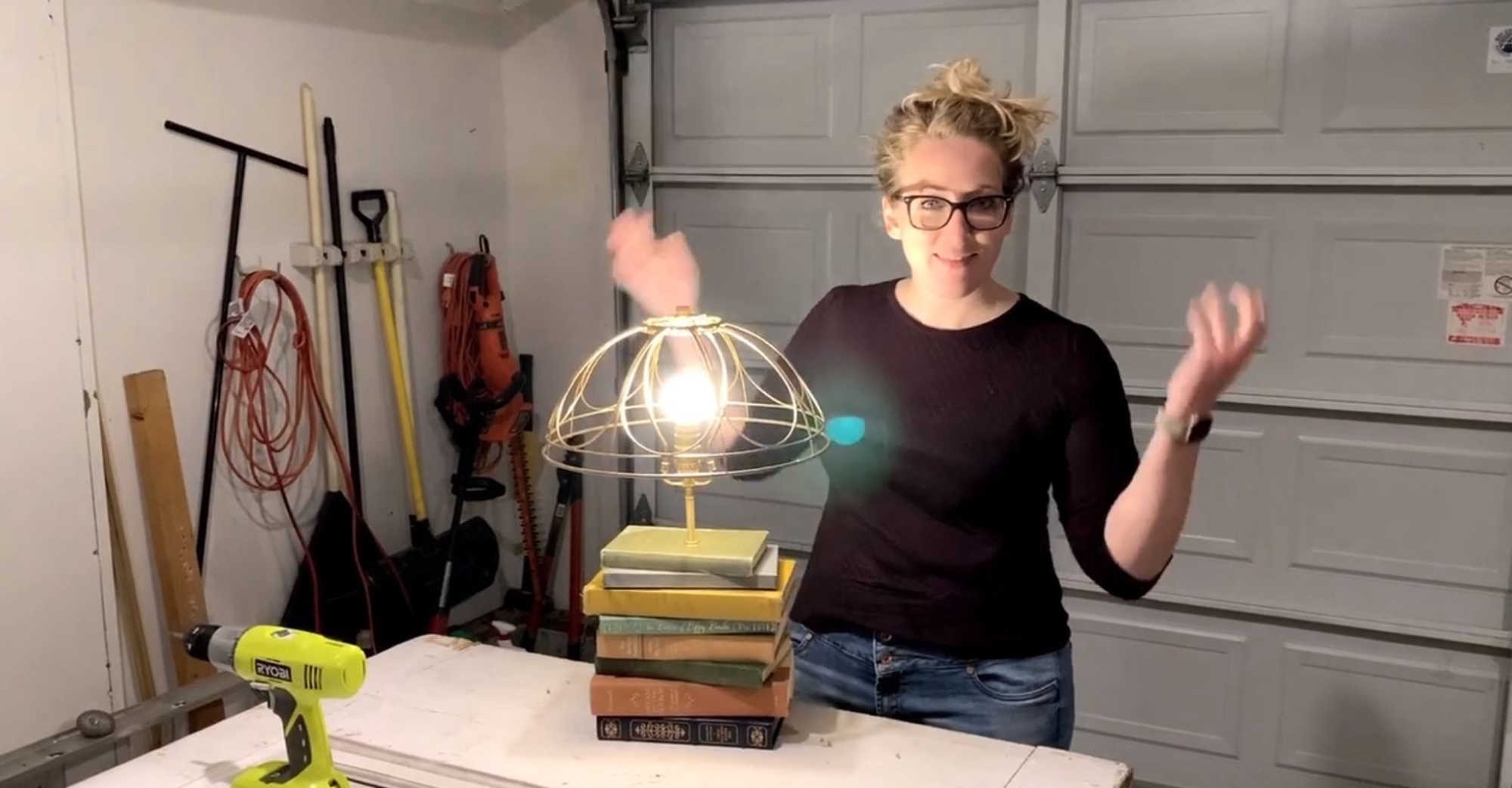 Mallory makes a lamp out of thrifted books.